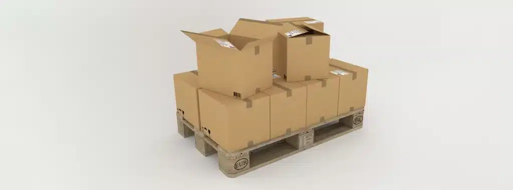 A stack of cardboard boxes arranged neatly on a white background representing tertiary packaging solutions